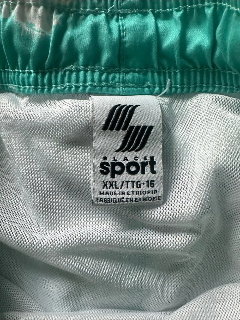 Boy’s Teal Palm-Print Swim Shorts